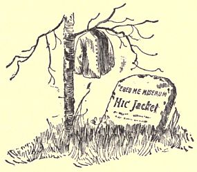 Tombstone next to dead small tree